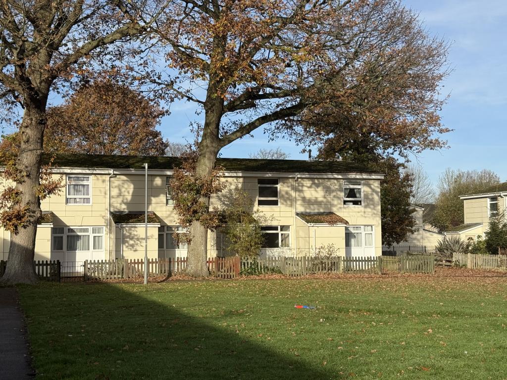 Lot: 61 - HOUSE IN NEED OF IMPROVEMENT - View across Green to House in Need of Improvement